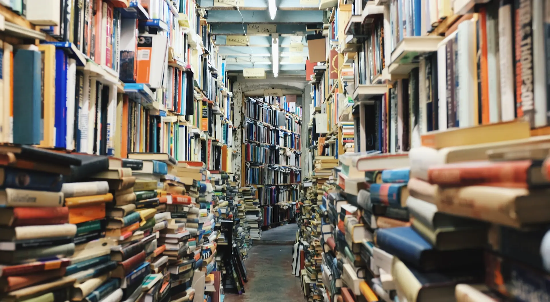 pathway in the middle of piled books